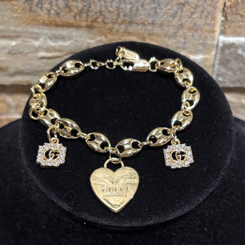 Gold Bracelet with a Gg Heart and Square Charms